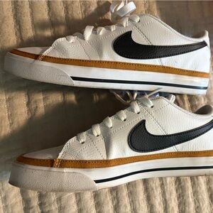 Nike womens White Sneakers with Gold and Black Accents court legacy